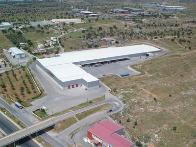Large warehouse with loading docks, seen from the air