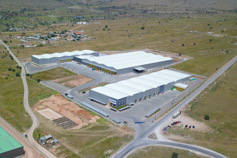 Group of warehouses with white roofs, aerial view