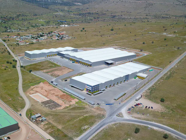 Group of warehouses with white roofs, aerial view