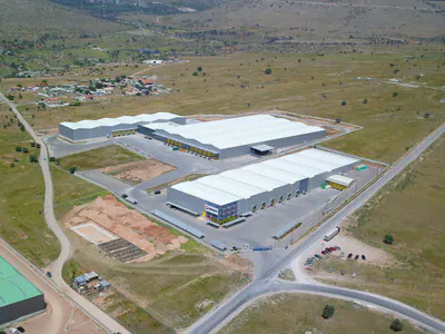 Group of warehouses with white roofs, aerial view