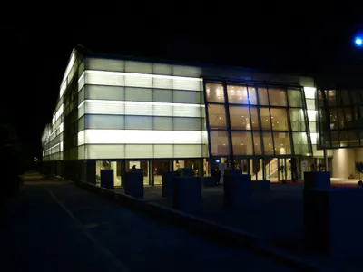 Building with a translucent facade, lit at night