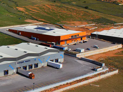 Aerial view of warehouses with a car park and a loading yard