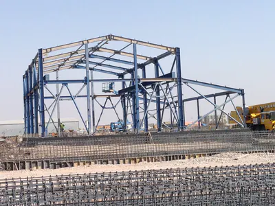 Blue steel building frame behind foundation reinforcement