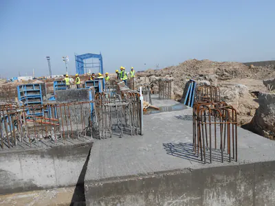 Foundation works with reinforcement cages, blue steel behind