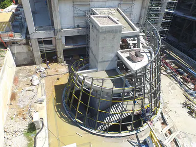 Curved concrete and steel structure with a stair core, seen from above