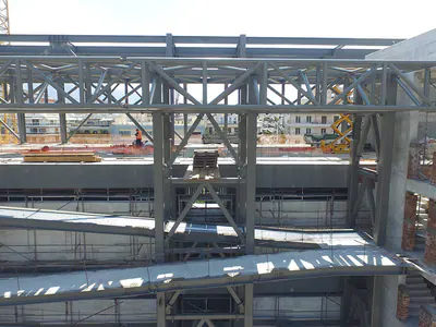 Steel trusses meeting a concrete stair core