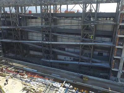 Steel beams on several levels inside a building under construction