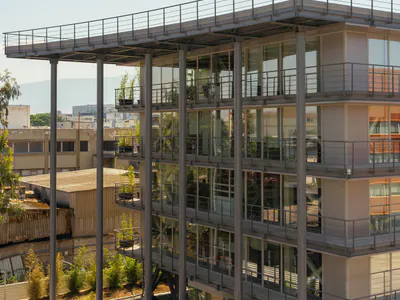 Steel-framed multi-storey building with a projecting roof canopy