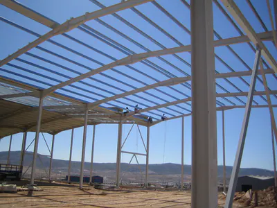 Steel roof frame of a building under construction, seen from inside