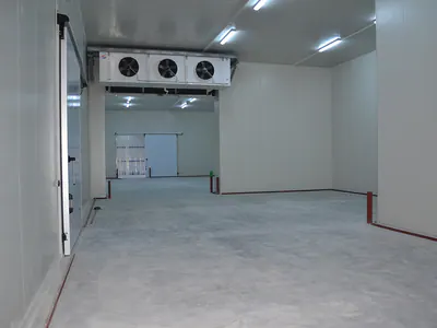 Empty cold store with insulated panel walls and a ceiling cooling unit