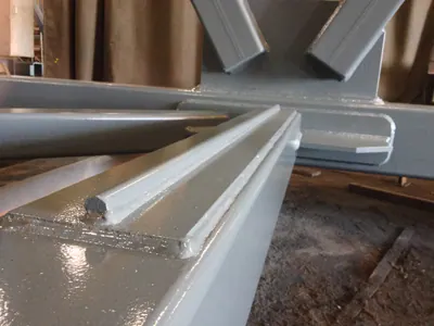 Close-up of welds at a steel truss connection