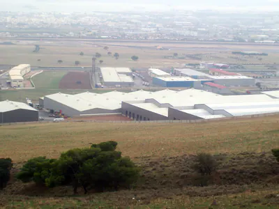 Industrial area with large warehouses, seen from a hillside
